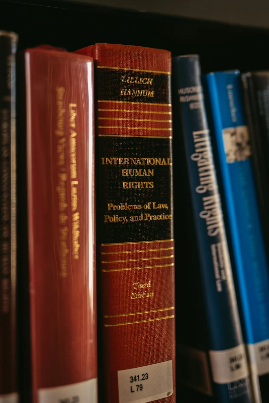 Books on law and human rights. Legal context photograph, unrelated to the case file and the people involved.