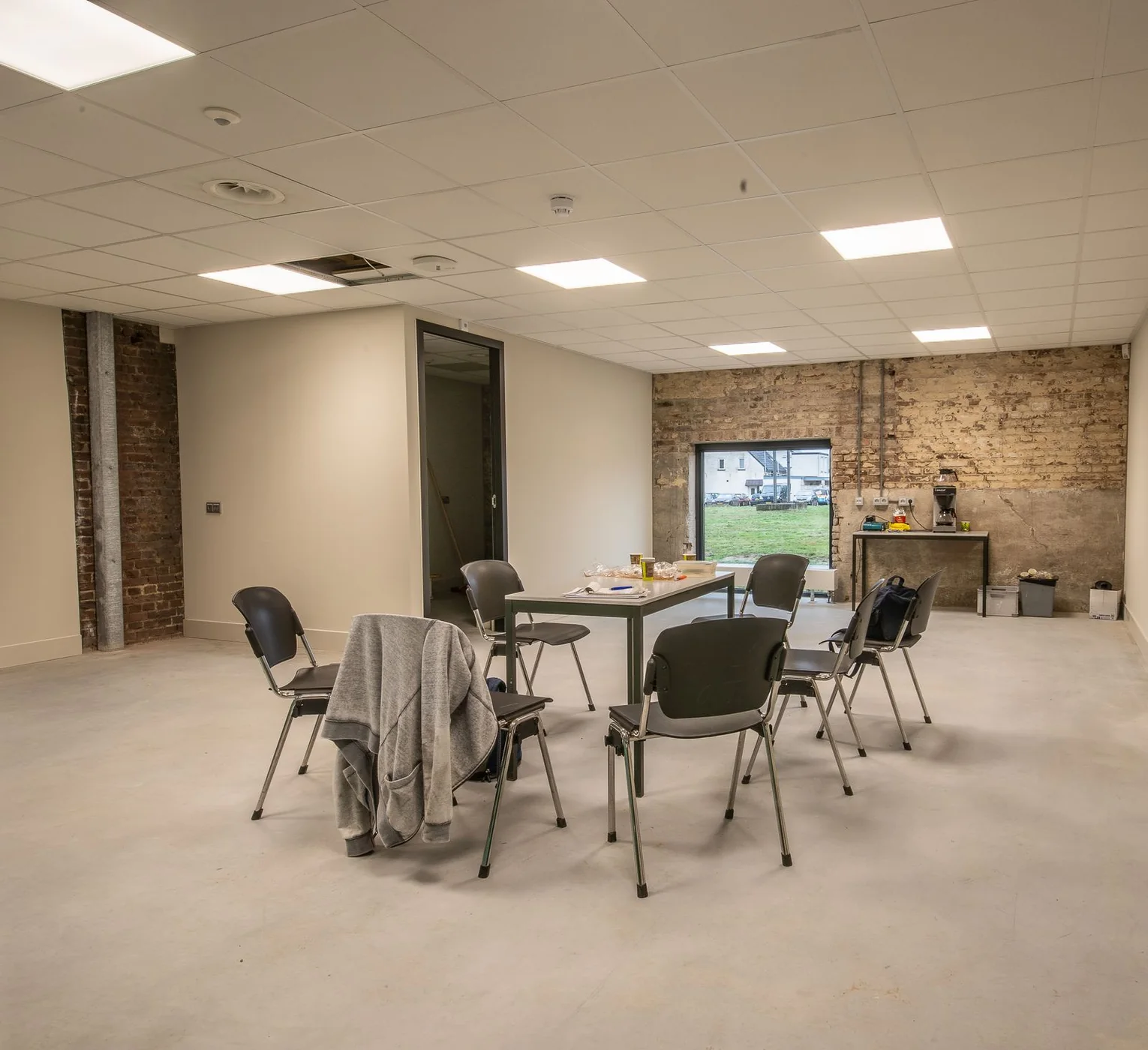 Room arranged for meetings and group learning. Stock photograph, separate from the Salisbury training venue.