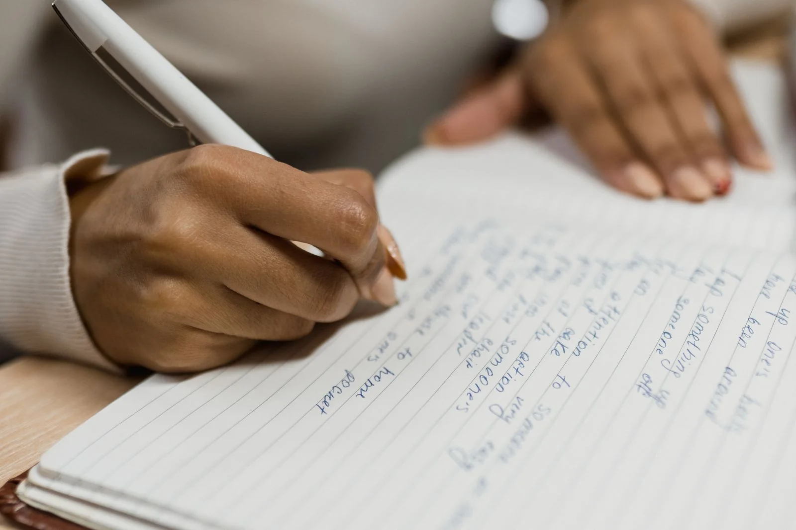 Notes being written in a notebook. Stock photograph of participation and recording views, not responses to the Scottish consultation.