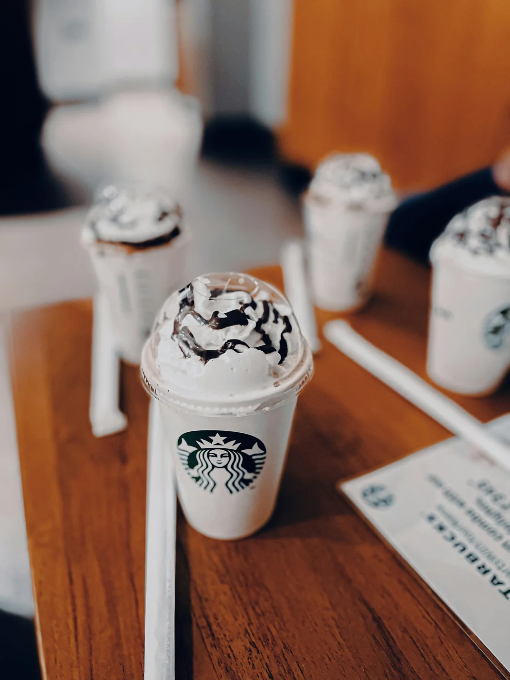 A cup with a lid and straw. Thematic photograph taken in Bengaluru, India; it does not show a California venue or certify this product’s protection.